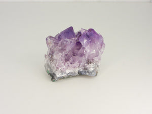 Beautiful Amethyst cluster with inclusions. Front view