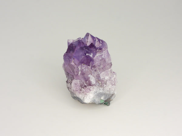 Beautiful Amethyst cluster with inclusions. Side view