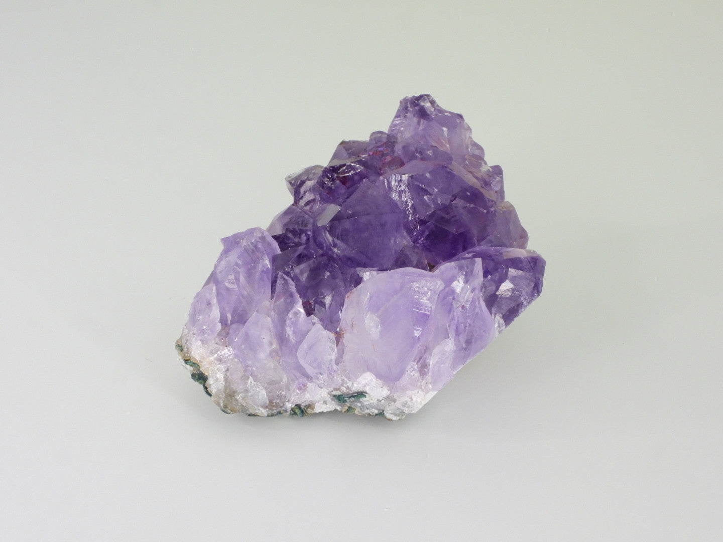 Beautiful Amethyst cluster with inclusions. Front view, close up