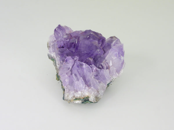 Beautiful Amethyst cluster with inclusions. Side view