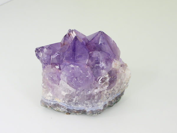 Beautiful Amethyst cluster with inclusions. Side view