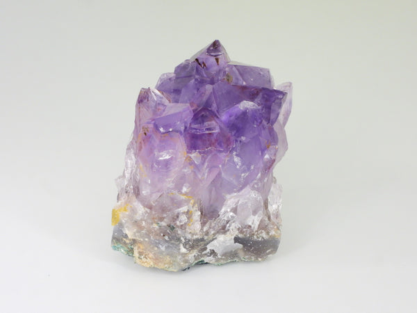 Beautiful Amethyst cluster with inclusions. Side view