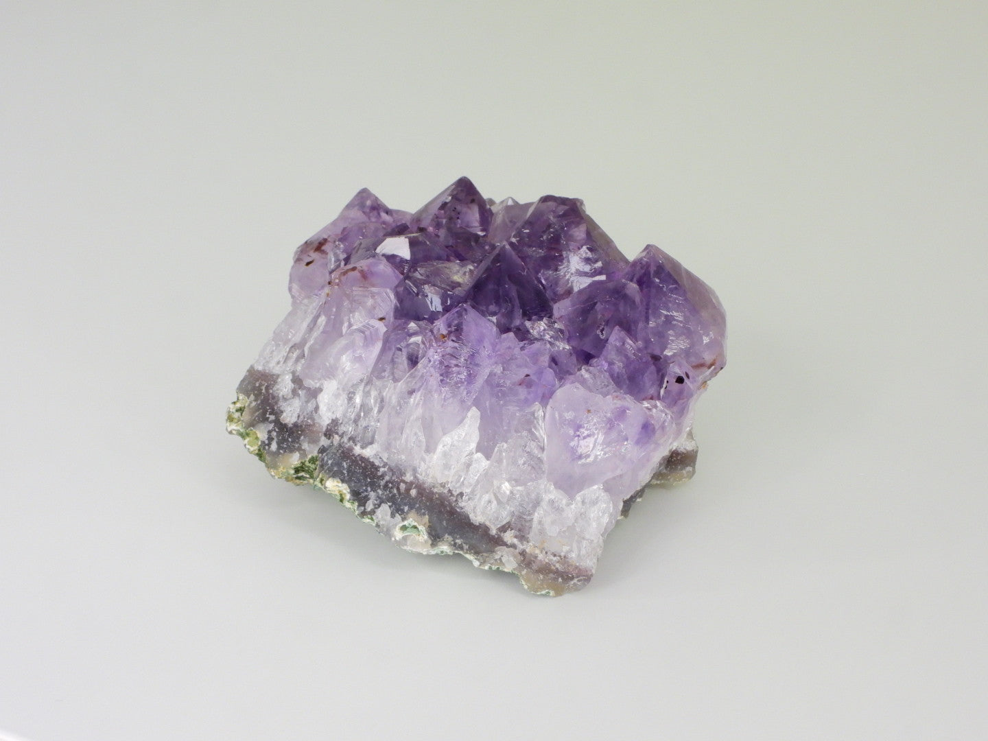 Beautiful Amethyst cluster with inclusions. Front view