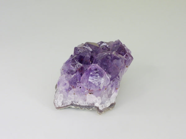 Beautiful Amethyst cluster with inclusions. Side view