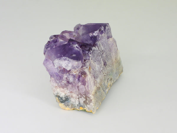 Beautiful Amethyst cluster with inclusions. Side view