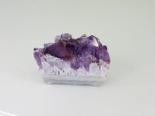 Beautiful Amethyst cluster with inclusions. Back view