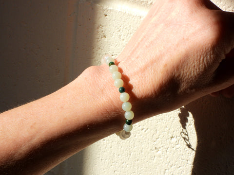 Bloodstone, Amazonite, Opalite and White Jade Bracelet on someone's wrist