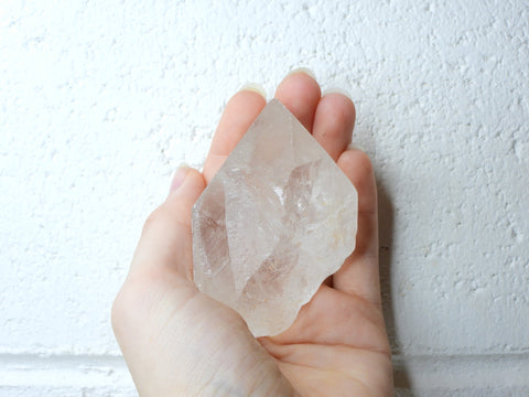 Himalayan Clear Quartz natural point in someone's hand