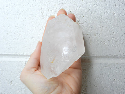 Himalayan Clear Quartz natural point in someone's hand